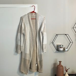 Warm tan and white cardigan. Worn once. Size small, could fit medium and large